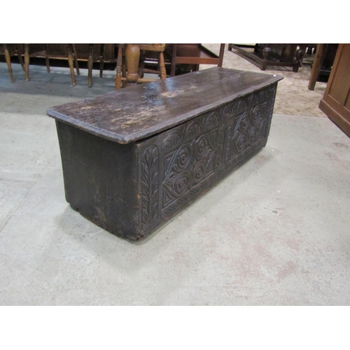 2237 - An 18th century and later over-carved elm coffer, 44cm high, 108 x 46cm.