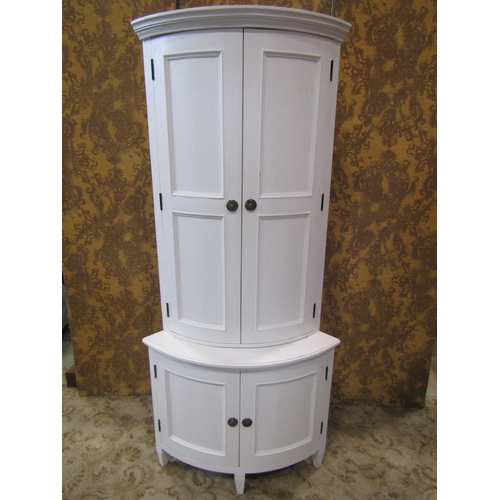 2260 - A Scandinavian design bow fronted freestanding corner cupboard, enclosed by two pairs of panelled do... 