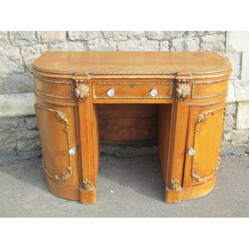 2261 - A 19th century pine dressing table of rounded rectangular form, with moulded gilt borders, 76cm high... 