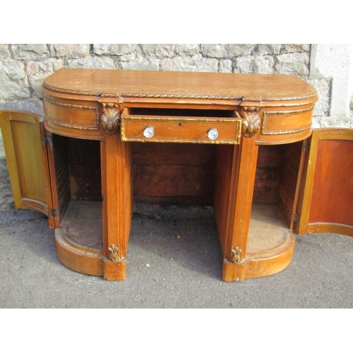 2261 - A 19th century pine dressing table of rounded rectangular form, with moulded gilt borders, 76cm high... 