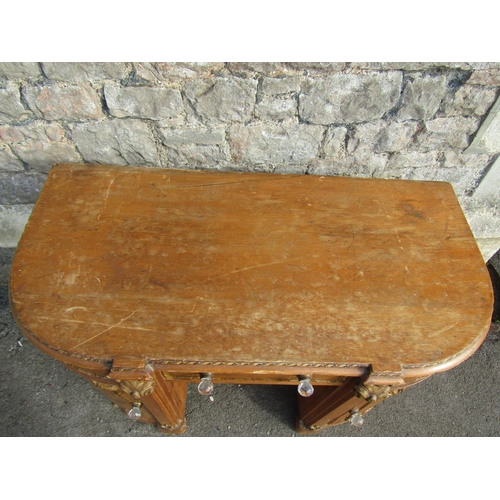 2261 - A 19th century pine dressing table of rounded rectangular form, with moulded gilt borders, 76cm high... 