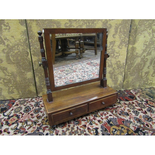 2748 - A Georgian mahogany toilet mirror the box base fitted with two drawers, the rectangular mirror plate... 