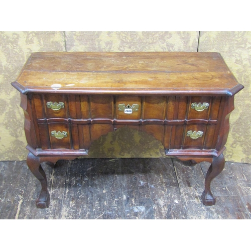 2658 - A colonial hardwood kneehole side table fitted with five drawers with shaped outline, raised on claw... 