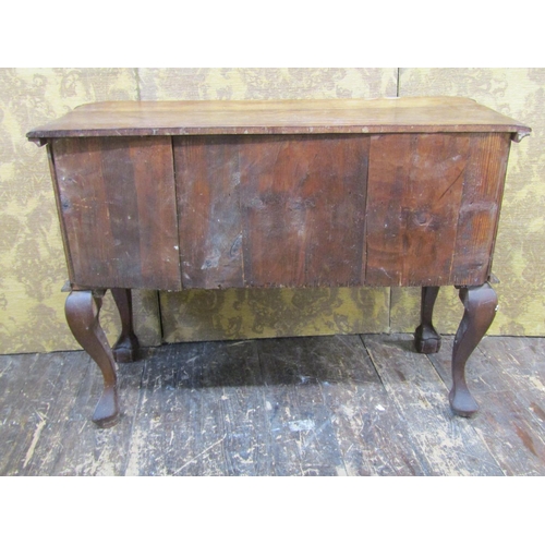 2658 - A colonial hardwood kneehole side table fitted with five drawers with shaped outline, raised on claw... 