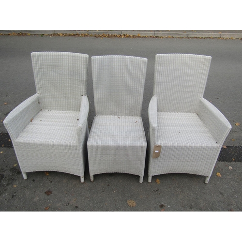 2065 - A pair of good quality rattan garden/conservatory armchairs together with a matching single chair