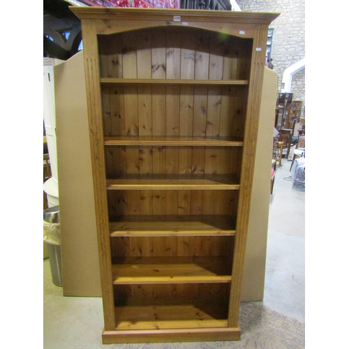 2152 - Two freestanding bookcases, a pine example with fluted sides, 200 cm high, 99 x 35 cm, together, wit... 