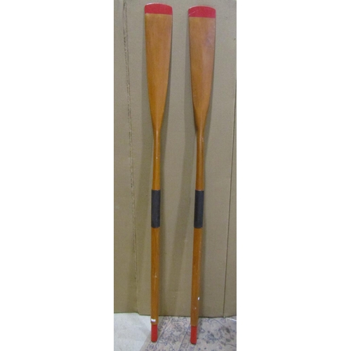 2160 - A vintage pair of wooden oars, 83cm high.