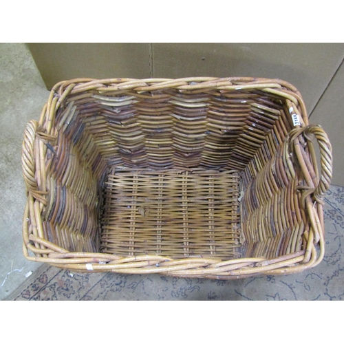 2168 - A large twin-handled wicker log basket, 56 cm high, 68 x 50 cm