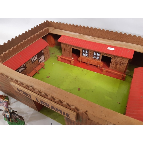 367 - Vintage wooden 'Fort Laramie' 52x37cm with an unsorted collection of plastic Wild West figures and a... 