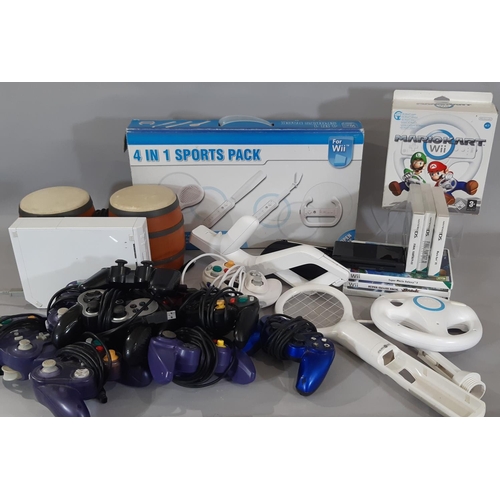 373 - A boxful of Wii and Nintendo items including Wii MarioKart, Wii Sports Packs, Nintendo DS Lite with ... 