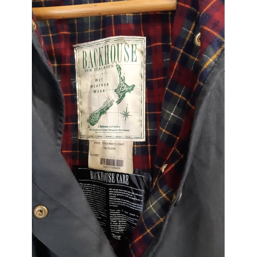 1740 - 'Stockman's Coat' jacket by Backhouse (Barbour Co), in dark blue heavy weight waxed cotton with stor... 