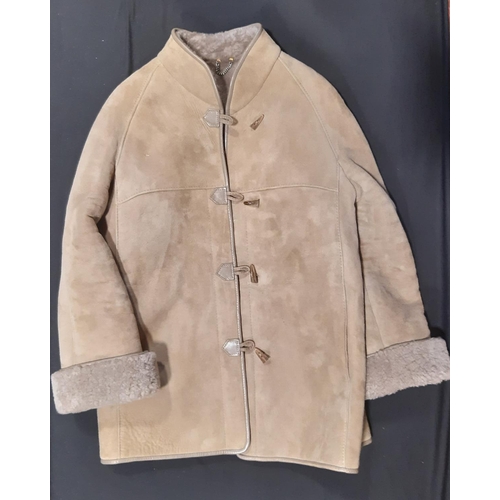 1742 - 3 sheepskin coats comprising a pale ladies jacket size 14 with toggle fastening, a dark brown men's ... 