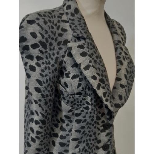 1746 - A late 1960s Biba two piece trouser suit in black/ grey leopard style jersey fabric; jacket has 3 fr... 