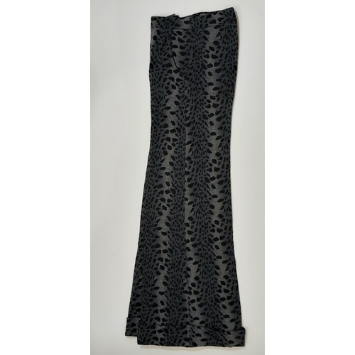 1746 - A late 1960s Biba two piece trouser suit in black/ grey leopard style jersey fabric; jacket has 3 fr... 