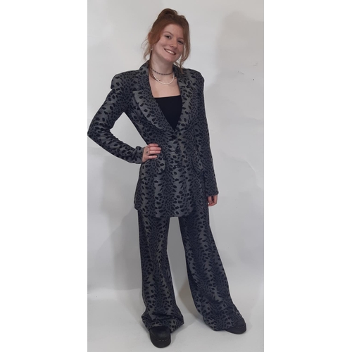 1746 - A late 1960s Biba two piece trouser suit in black/ grey leopard style jersey fabric; jacket has 3 fr... 