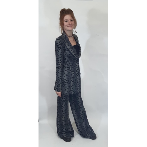 1746 - A late 1960s Biba two piece trouser suit in black/ grey leopard style jersey fabric; jacket has 3 fr... 