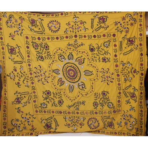 1748 - Large Suzani panel with embroidered floral stems surrounding a central circular motif, on saffron co... 