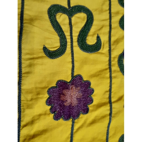 1748 - Large Suzani panel with embroidered floral stems surrounding a central circular motif, on saffron co... 