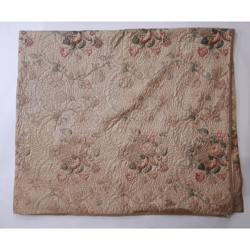 1754 - A pair of vintage quilted bedspreads in  a printed floral cotton chintz, quilted in chain stitch usi... 