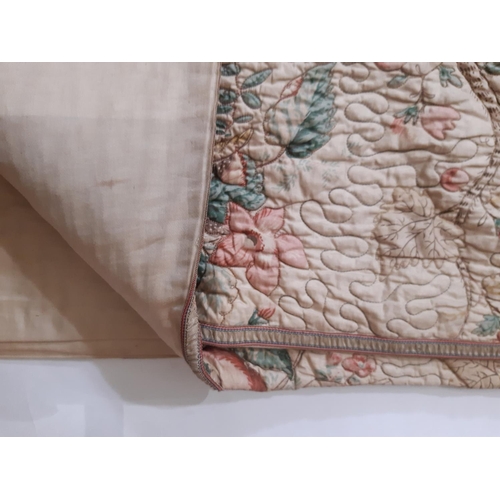 1754 - A pair of vintage quilted bedspreads in  a printed floral cotton chintz, quilted in chain stitch usi... 