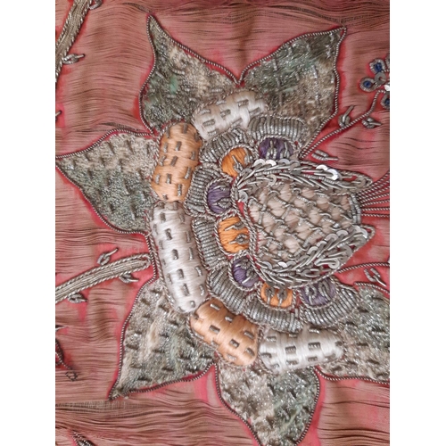 1766 - Indian textile panel depicting a peacock, heavily embellished with goldwork and beading surrounded b... 