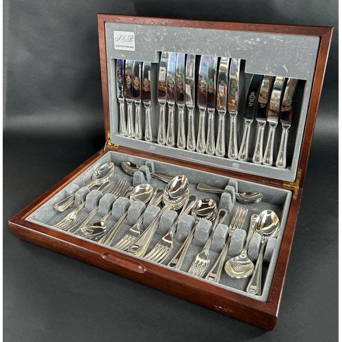 1155 - A Canteen of Sheffield cutlery with beaded handles, complete for eight settings.