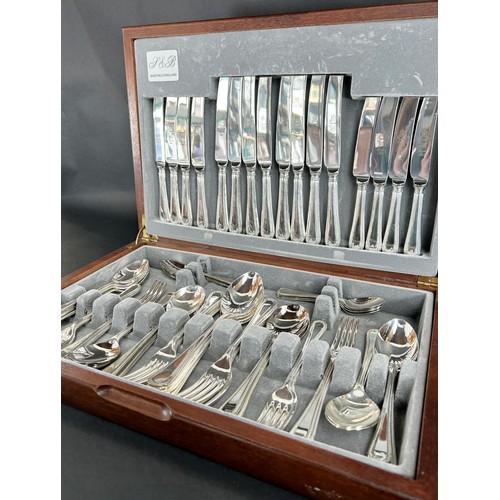 1155 - A Canteen of Sheffield cutlery with beaded handles, complete for eight settings.