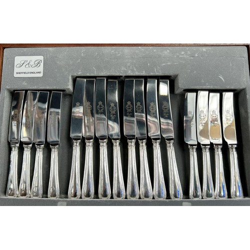 1155 - A Canteen of Sheffield cutlery with beaded handles, complete for eight settings.