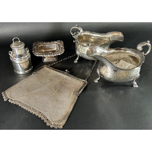 1159 - A pair of Georgian style silver plated gravy boats, a miniature milk churn, an open salt and a mesh ... 