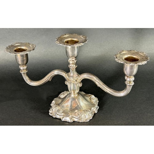 1162 - An Edwardian silver plated pierced comport and a silver plated three sconce candelabra.