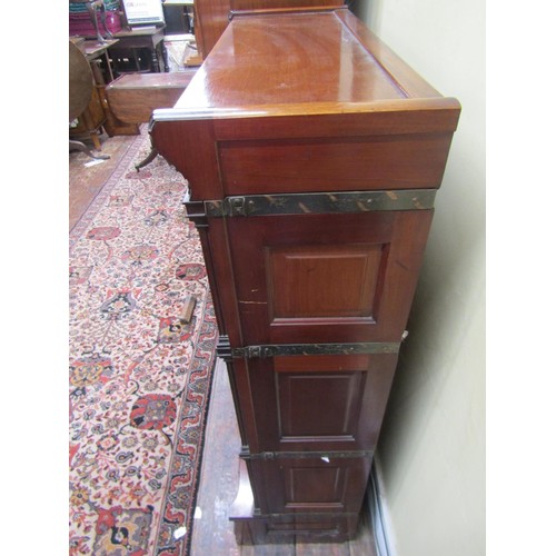 2746 - A four tier globe Wernicke mahogany sectional bookcase. The three leaded light doors over a single d... 