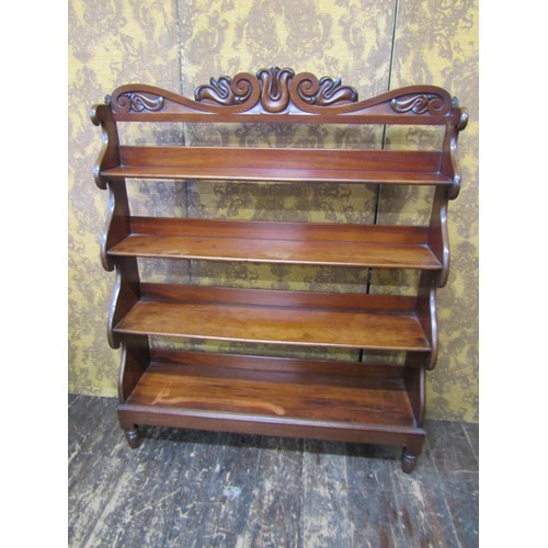 2742 - Regency mahogany waterfall bookcase on four graduated tiers with shaped outline on turned supports, ... 