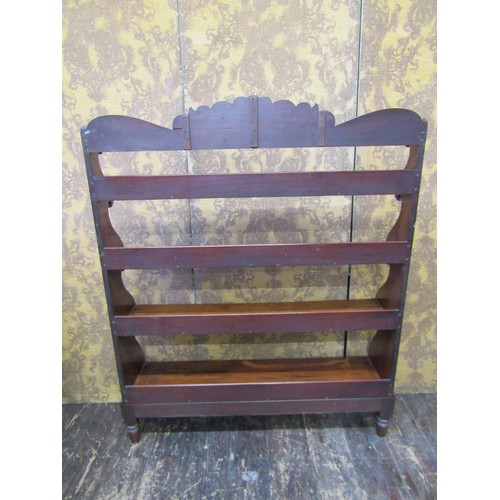 2742 - Regency mahogany waterfall bookcase on four graduated tiers with shaped outline on turned supports, ... 