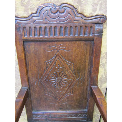 2736 - An old English oak Wainscote chair, the panelled back with lozenge shaped and carved detail, set ben... 