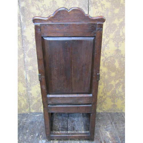 2736 - An old English oak Wainscote chair, the panelled back with lozenge shaped and carved detail, set ben... 