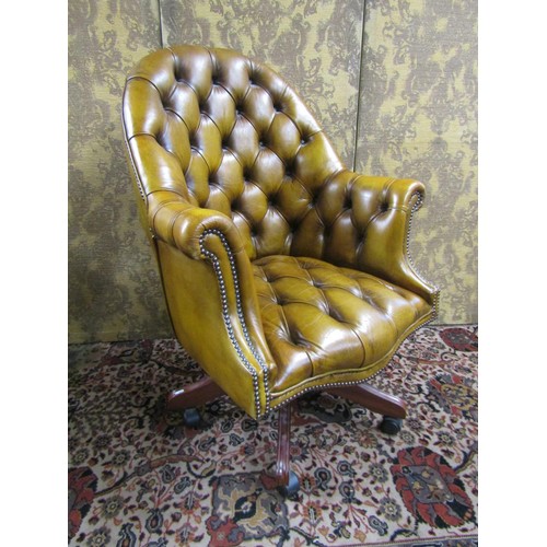 2728 - A good quality office chair upholstered in buttoned back leatherette finish with additional brass st... 