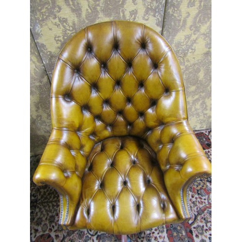 2728 - A good quality office chair upholstered in buttoned back leatherette finish with additional brass st... 