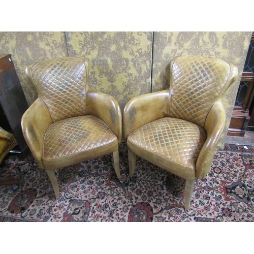 2724 - Timothy Olton - A pair of 'Side Saddle' tanned leather upholstered elbow chairs, cross hatched seats... 