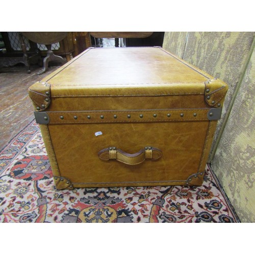 2718 - A good quality travelling trunk ottoman with pale tan coloured leather finish and studwork borders, ... 