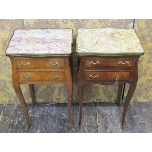 2716 - A pair of continental side tables each with shaped outline and enclosing two drawers set beneath fig... 