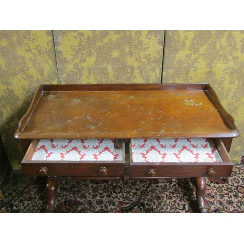 2711 - A mid Victorian period mahogany side table enclosing two frieze drawers with three quarter gallery a... 