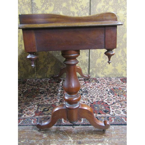 2711 - A mid Victorian period mahogany side table enclosing two frieze drawers with three quarter gallery a... 