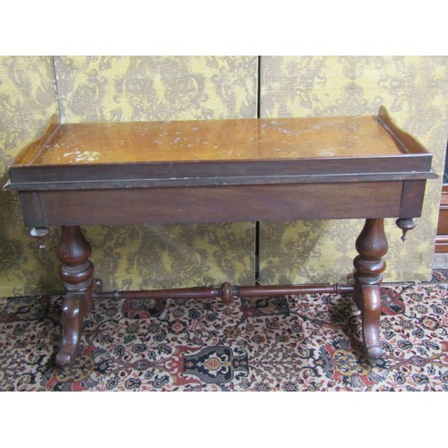 2711 - A mid Victorian period mahogany side table enclosing two frieze drawers with three quarter gallery a... 