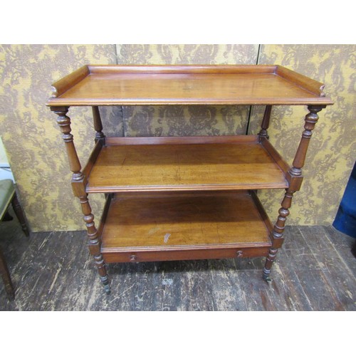 2709 - A mid Victorian period mahogany three tier buffet  with shallow frieze drawer on turned supports, 98... 