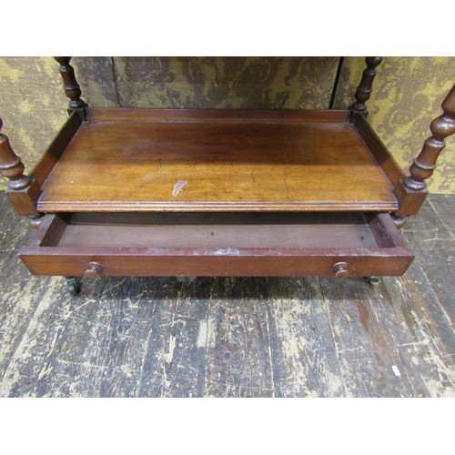 2709 - A mid Victorian period mahogany three tier buffet  with shallow frieze drawer on turned supports, 98... 