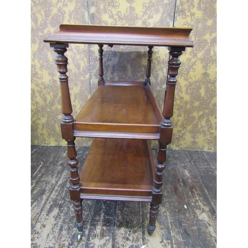 2709 - A mid Victorian period mahogany three tier buffet  with shallow frieze drawer on turned supports, 98... 