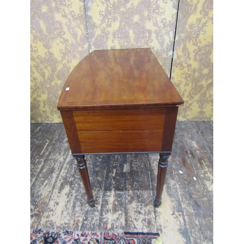 2707 - A Regency mahogany side table, the central drawer flanked by further drawer and cupboard, raised on ... 