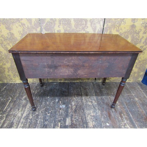 2707 - A Regency mahogany side table, the central drawer flanked by further drawer and cupboard, raised on ... 