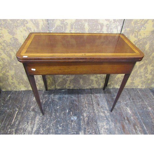 2706 - A 19th century mahogany D end fold-over top tea table crossbanded in satinwood and raised on square ... 