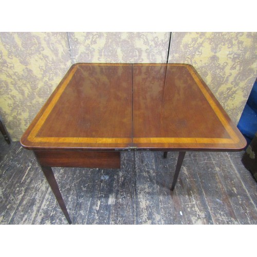 2706 - A 19th century mahogany D end fold-over top tea table crossbanded in satinwood and raised on square ... 